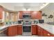Updated kitchen features stainless steel appliances and stone countertops at 6319 W Mercer Ln, Glendale, AZ 85304