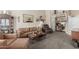 Comfortable living room featuring ample seating and a built-in desk area at 6319 W Mercer Ln, Glendale, AZ 85304