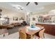Open floor plan shows the living room flowing into dining and kitchen areas at 6319 W Mercer Ln, Glendale, AZ 85304