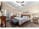 Cozy main bedroom featuring a ceiling fan, bedside tables and furniture set at 6319 W Mercer Ln, Glendale, AZ 85304