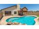 Beautiful pool with stone accents, pergola covered patio, and views of the home at 6319 W Mercer Ln, Glendale, AZ 85304