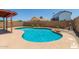 Inviting backyard pool featuring a pergola-covered patio and ample deck space for relaxation at 6319 W Mercer Ln, Glendale, AZ 85304