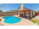 Private backyard oasis with a sparkling pool and covered patio, perfect for outdoor entertaining at 6319 W Mercer Ln, Glendale, AZ 85304
