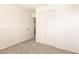 Comfortable bedroom offers carpet, closet and a door leading outside at 6521 W Flower St, Phoenix, AZ 85033