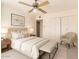 Cozy bedroom with soft lighting, neutral decor, and ample closet space, perfect for restful nights and organized living at 6521 W Flower St, Phoenix, AZ 85033