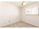 Simple bedroom with carpeting, window and ceiling fan at 6521 W Flower St, Phoenix, AZ 85033