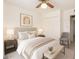 Serene bedroom with a ceiling fan, generous closet space, and soft lighting, ensuring a peaceful and organized sanctuary at 6521 W Flower St, Phoenix, AZ 85033