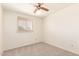 Cozy bedroom with carpet and window; a serene personal space at 6521 W Flower St, Phoenix, AZ 85033