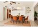 Charming dining area featuring pendant lighting, seating for six, and built-in shelving for added storage and decor at 6521 W Flower St, Phoenix, AZ 85033
