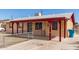 This single-story home has a covered entry and low fences to keep the yard safe at 6521 W Flower St, Phoenix, AZ 85033