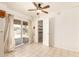 A bright kitchen with tiled flooring, a sliding glass door, and a walk-in closet at 6521 W Flower St, Phoenix, AZ 85033