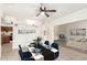 A living room showcases a modern table with seating, and calming staged decorations at 6521 W Flower St, Phoenix, AZ 85033