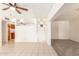 A living room offers tile and carpet flooring and an easy kitchen access at 6521 W Flower St, Phoenix, AZ 85033