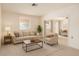 Comfortable living room featuring neutral tones, plush seating, and an open layout for relaxed living and entertaining at 6521 W Flower St, Phoenix, AZ 85033