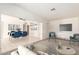 Staged Living room offers carpet and tile flooring and open floor plan at 6521 W Flower St, Phoenix, AZ 85033