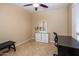 Neutral bedroom with tiled floors, a ceiling fan, and abundant natural light at 6610 E University Dr # 127, Mesa, AZ 85205