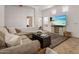 Bright living room with large sectional sofa and access to the backyard patio at 6610 E University Dr # 127, Mesa, AZ 85205