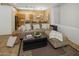 Open-concept living space with comfortable seating adjacent to the kitchen and dining areas at 6610 E University Dr # 127, Mesa, AZ 85205