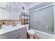 Bathroom with sleek vanity, medicine cabinet, and a shower-tub combo at 6721 E Mcdowell Rd # B309, Scottsdale, AZ 85257