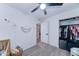 Bright Bedroom with a crib, closet, and neutral decor at 6721 E Mcdowell Rd # B309, Scottsdale, AZ 85257