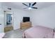 Bedroom with neutral walls, natural light, wood-look floors, and a dresser at 6721 E Mcdowell Rd # B309, Scottsdale, AZ 85257
