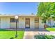 Charming exterior view of the property with a well-kept lawn and inviting walkway at 6721 E Mcdowell Rd # B309, Scottsdale, AZ 85257