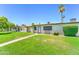 Well-maintained front yard with a walkway to the home's entrance and mature landscaping at 6721 E Mcdowell Rd # B309, Scottsdale, AZ 85257