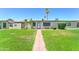 Inviting front yard with a brick path leading to the entrance of the residence at 6721 E Mcdowell Rd # B309, Scottsdale, AZ 85257