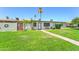Lush front yard featuring a brick path and views of mature trees at 6721 E Mcdowell Rd # B309, Scottsdale, AZ 85257