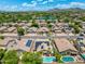 Aerial view of neighborhood with a lake and mountain backdrop, showcasing community and environment at 6967 W Irma Ln, Glendale, AZ 85308