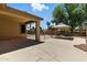Spacious covered patio and yard with a pool view, perfect for outdoor entertaining at 6967 W Irma Ln, Glendale, AZ 85308