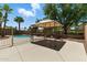 Outdoor gazebo enhances the backyard ambiance, creating a cozy spot for relaxation with views of the pool at 6967 W Irma Ln, Glendale, AZ 85308