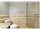 Bathroom featuring beautiful tile and a glass door shower at 6967 W Irma Ln, Glendale, AZ 85308