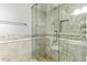Bathroom with a glass-door shower and beautiful tile at 6967 W Irma Ln, Glendale, AZ 85308