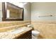 This bathroom features a sink with granite countertop and tiled walls at 6967 W Irma Ln, Glendale, AZ 85308