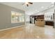 Open floor plan shows kitchen with stainless steel appliances and tiled floors at 6967 W Irma Ln, Glendale, AZ 85308