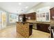 Bright kitchen boasts an island, stainless steel appliances, and lots of natural light at 6967 W Irma Ln, Glendale, AZ 85308