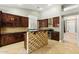 Spacious kitchen with custom cabinetry, granite counters, tile backsplash, and stainless appliances at 6967 W Irma Ln, Glendale, AZ 85308