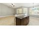 Kitchen with island, modern lighting, stainless appliances, and shutters at 6967 W Irma Ln, Glendale, AZ 85308