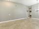 Spacious living room featuring tile floors, recessed lighting, and neutral paint colors at 6967 W Irma Ln, Glendale, AZ 85308