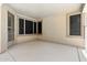 Enclosed patio provides a versatile space for relaxation or entertaining, offering seamless transition from indoor to outdoor living at 6967 W Irma Ln, Glendale, AZ 85308