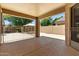 Covered patio showcasing ample space for outdoor furniture and entertaining, connecting indoor comfort with outdoor leisure at 6967 W Irma Ln, Glendale, AZ 85308
