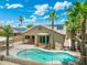 Backyard pool view with desert landscaping and privacy fence, perfect for outdoor relaxation at 6967 W Irma Ln, Glendale, AZ 85308