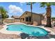 Inviting backyard pool featuring a well-maintained patio and landscaping, perfect for outdoor enjoyment and entertaining at 6967 W Irma Ln, Glendale, AZ 85308