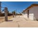 A wide concrete patio stretches behind the house, bordered by cinderblock posts at 716 S Lewis --, Mesa, AZ 85210