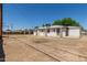 This property features a large backyard with a patio extending from the home at 716 S Lewis --, Mesa, AZ 85210