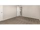 A cozy bedroom featuring neutral carpet, a wall paint color, and ample natural light at 716 S Lewis --, Mesa, AZ 85210