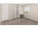 A bedroom featuring neutral walls, carpet, closet space and a built-in desk is shown at 716 S Lewis --, Mesa, AZ 85210