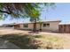 Single-story home featuring mature trees and a well-maintained front yard at 716 S Lewis --, Mesa, AZ 85210
