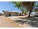 Single-story home featuring a carport and spacious driveway at 716 S Lewis --, Mesa, AZ 85210